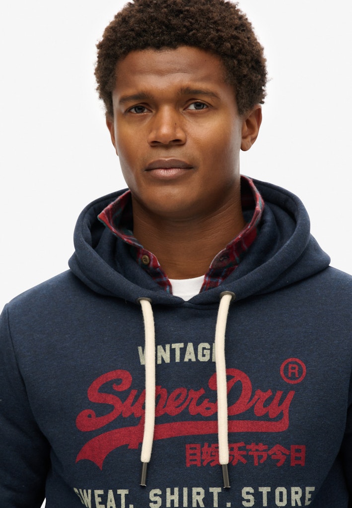 Sudadera de corte relajado con capucha y logo Vintage Heritage [fc:image_id:672c5945be144b7a52c842a1] [fc:hash:89759e1dbad76a3058928c9c29b10f6fbc01197c]