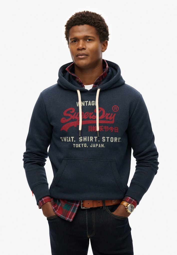 Sudadera de corte relajado con capucha y logo Vintage Heritage [fc:image_id:672c5951be144b7a52c842ba] [fc:hash:61eca29a46c9650e211500eec5e85d8c9c4fba24]