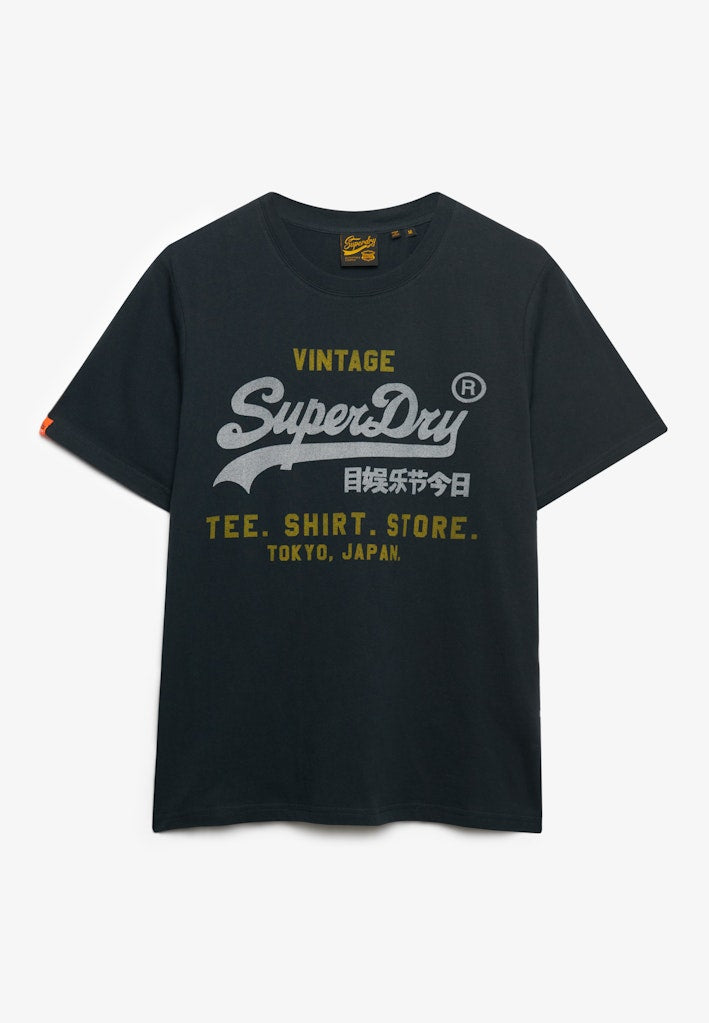 Camiseta de corte relajado Heritage con logo Vintage [fc:image_id:68dd6da2e833a6d486baf427] [fc:hash:c27c3d27c3869cc01a2af064a49a6695e28d3e23]